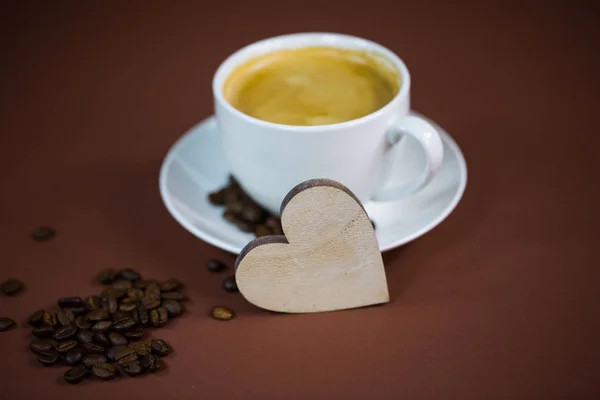 Cup of coffee with heart, brown background, invitation, card — Stock Photo, Image