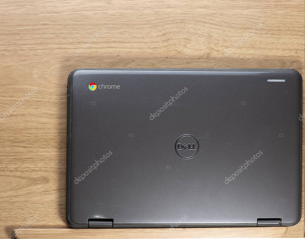 Elgin, Illinois - Circa 2019: A Chromebook Dell Convertable Chromebook on a wooden desk.