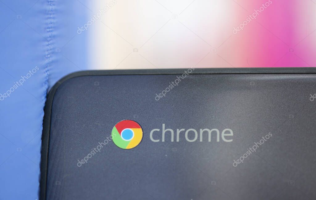 Elgin, Illinois - Circa 2019: An Dell Ecducational Edition Chromebook ok a blue mat against a blurred background.