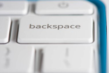 A laptop backspace key symbolizing things like deletion of things; taking a step back; fixing mistakes, and other abstract concepts. clipart