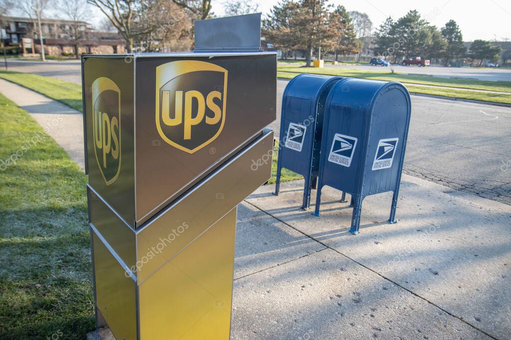 Chicago Illinois, USA - Circa 2020: An abstract representation of government versus privately owned companies.A USPS and UPS drop off location shown in a manor to reflect their fierce competition and rivalry.