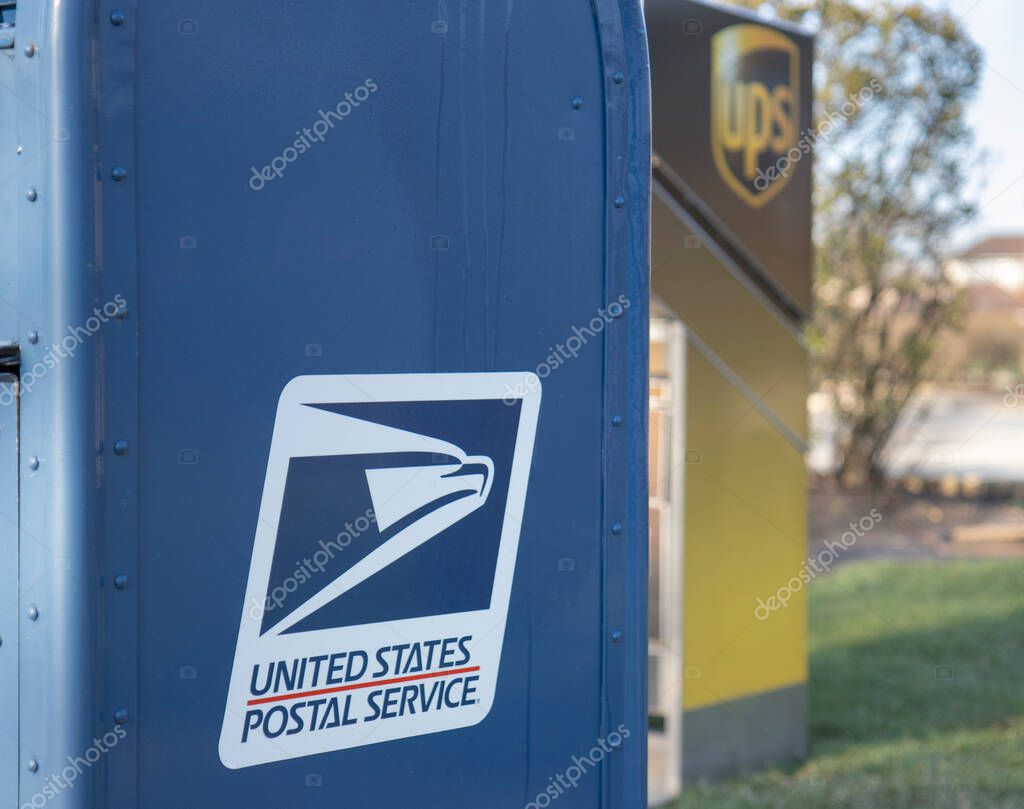 Chicago Illinois, USA - Circa 2020: An abstract representation of government versus privately owned companies.A USPS and UPS drop off location shown in a manor to reflect their fierce competition and rivalry.