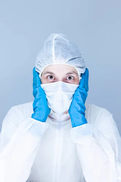 Man Protective Suit Gloves Mask His Face Holding His Head — Stock Photo, Image