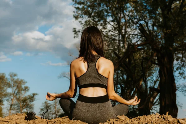 Yoga in nature, health woman. Concept of healthy lifestyle and relaxation