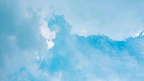 blue sky horizontal with beautiful puffy fluffy clouds with sunlight, abstract nature background