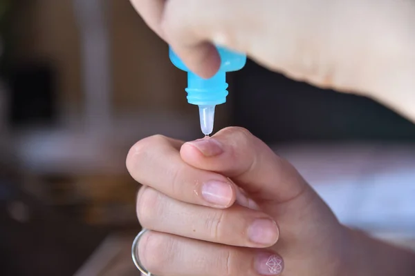 stock image Young woman taking care of her nails at home, making manicure