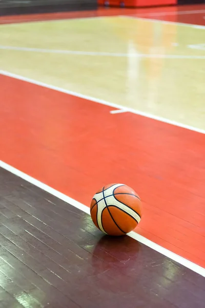 Basketball ball on the parquet floor