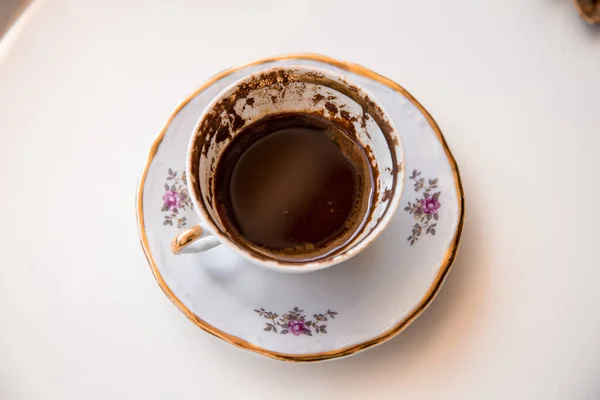 A cup of Turkish coffee, traditionally using for fortune telling. traditional porcelain turkish coffee cup