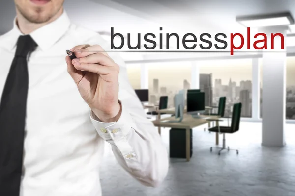 Empresário escrevendo plano de negócios no ar — Fotografia de Stock