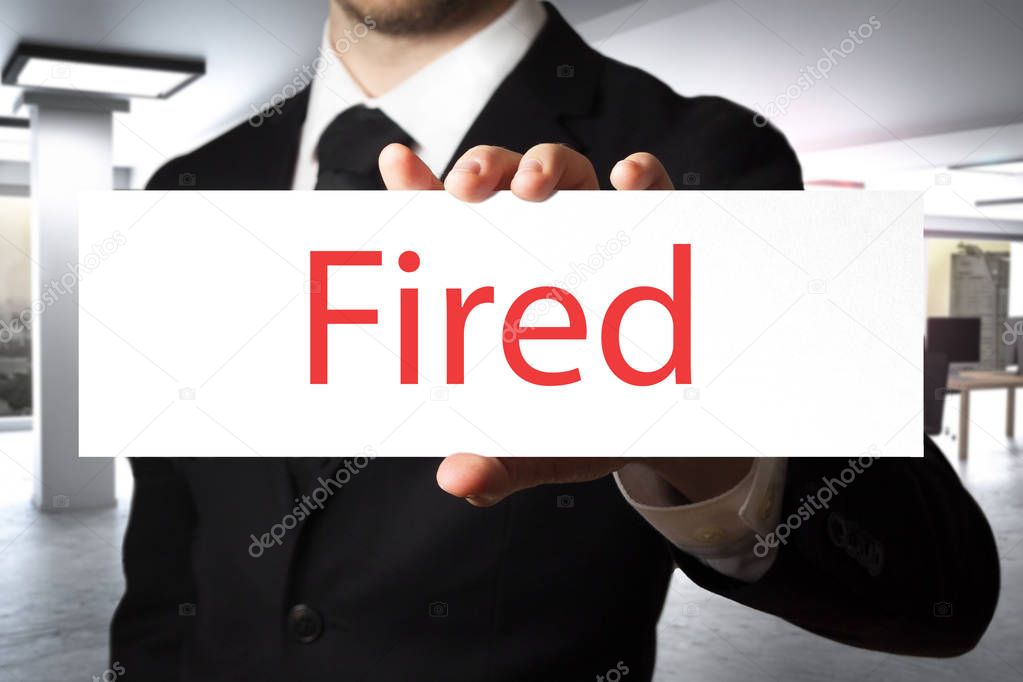 businessman showing sign fired