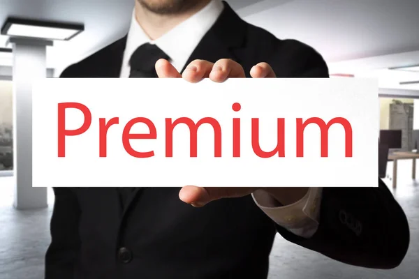 Businessman holding sign premium — Stock Photo, Image