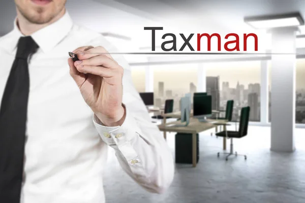 Businessman writing taxman in the air — Stock Photo, Image