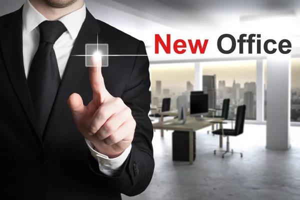 Businessman pushing button new office — Stock Photo, Image