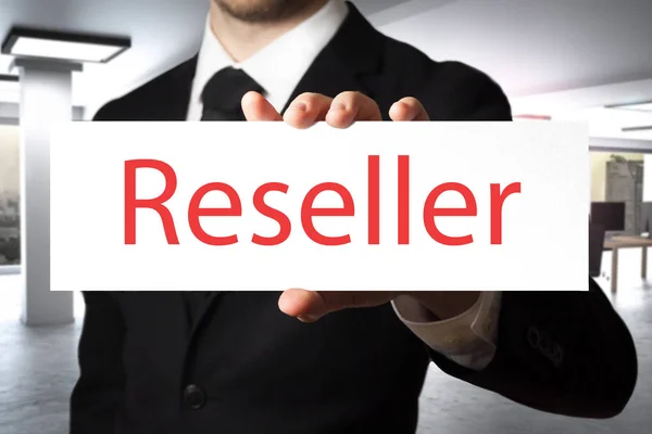 Businessman holding sign reseller — Stock Photo, Image