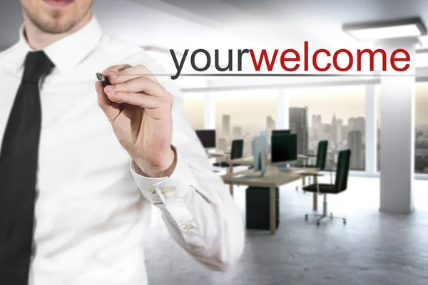 Hombre de negocios escribiendo su bienvenida en el aire — Foto de Stock