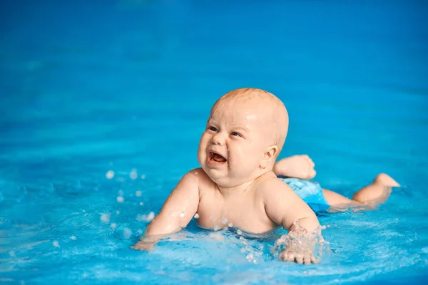 Unhappy Funny Little Baby Boy Lying Blue Swimming Pool Splashing — Stock Photo, Image