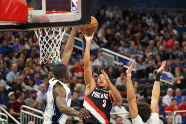 Portland Traillblazers oyuncusu CJ Mccollum # 3, 2 Mart 2020 tarihinde Orlando Florida 'daki Amway Center' da oynanan maç sırasında turnikeye katılma girişiminde bulundu. Fotoğraf: Marty Jean-Louis