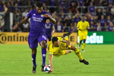 Columbus Crew SC's Artur gets fouled by Orlando City's Carlos Ascues at Exploria stadium in Orlando, Florida on Saturday July 13, 2019.  Photo Credit:  Marty Jean-Louis clipart