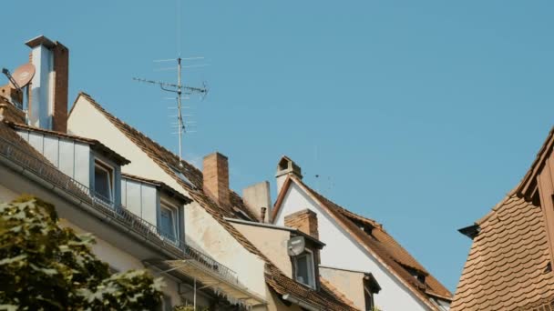 German house roof on blue sky background — Stock Video