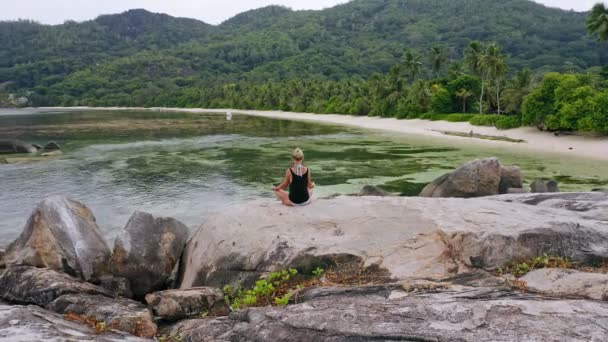 Aerial Circling Footage Blonde Girl Relaxing Yoga Pose Granite Rock — Stock Video