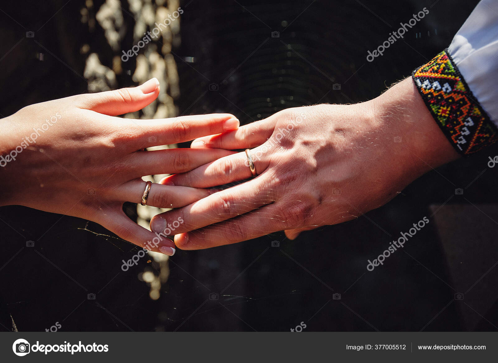 young spouses play with love rings that they have given themselves - a  Royalty Free Stock Photo from Photocase