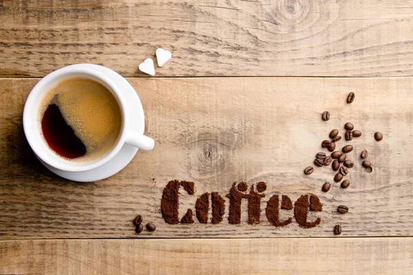 Coffee composition with cup and coffee beans — Stock Photo, Image