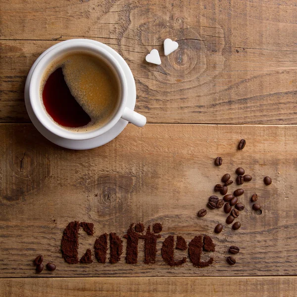 Coffee composition with cup and coffee beans — Stock Photo, Image