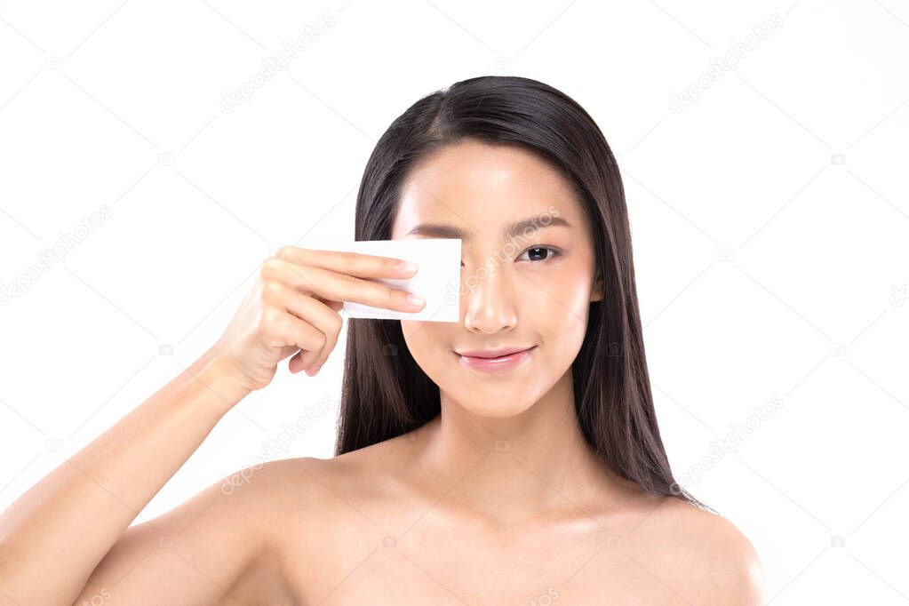 Attractive Charming Asian young woman smile and using tissue with toner for cleaning make up feeling so fresh and clean with healthy skin,isolated on white background,Beauty Cosmetics Concept