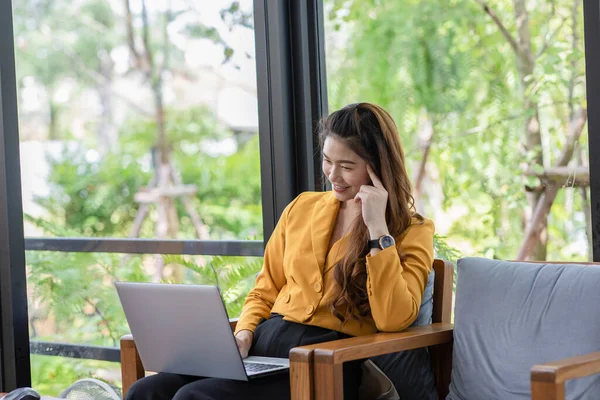 Business Asian young woman working with computer laptop and thinking to get ideas and requirement in Business startup feeling so happiness,Small Business Startup Concept