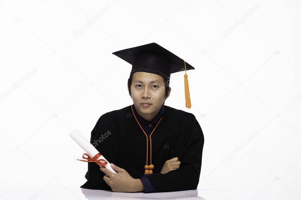Asian Graduate man in cap and gown smile with certificated or diploma so proud and happiness in Graduation day,Isolated on white Background,Education Graduation Concept