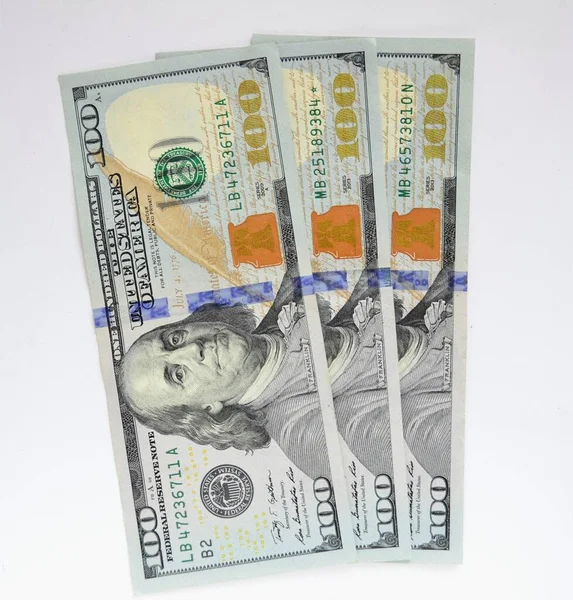 Beyaz Arka Planda Dolar Üst Görünüm — Stok fotoğraf