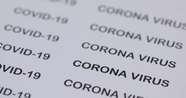 Covid-19 'un adı kağıda basılmış.