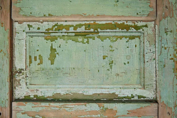 The texture of the wood on the old vintage furniture. A crack in the paint and on the wood surface.