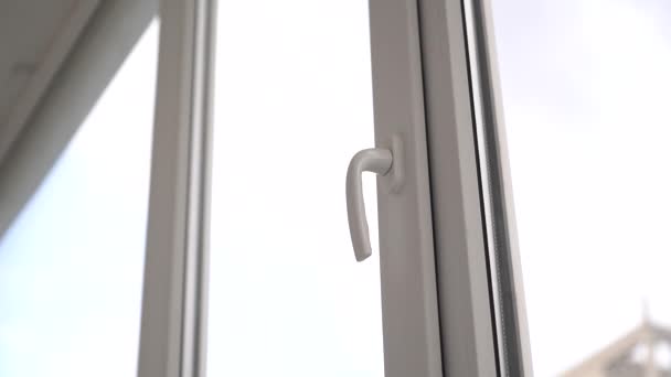 Man Opens Closes White Plastic Window Handle — Stock Video