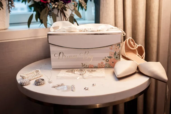 Expensive branded wedding shiny shoes. Accessories in a classic elegant interior