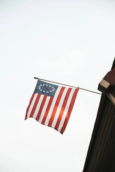 American flag on the roof of the house