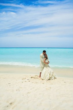 wedding couple on the beach in Maldives clipart