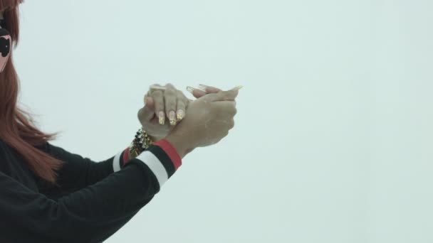 Young woman washing hand on white background covid-19 — Stock Video