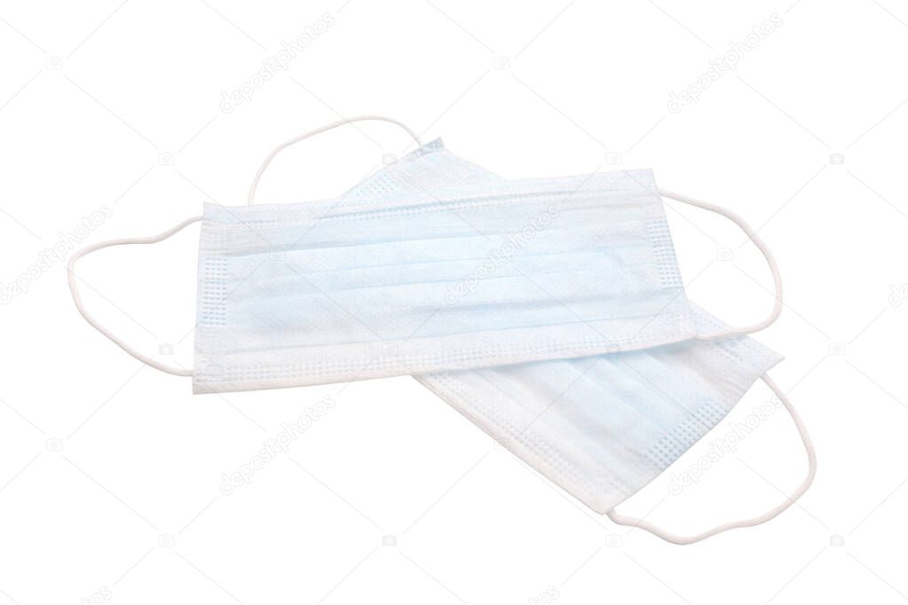 Medical masks on a white background. A disposable surgical face mask covers the mouth and nose
