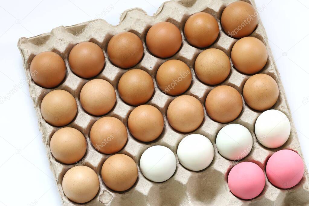 Fresh eggs on white background with concept of food and life in abstract indicated by the differentiate color of eggs.