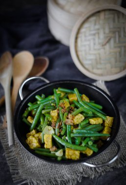 Tumis buncis,stir fry bean indonesian with tempeh clipart