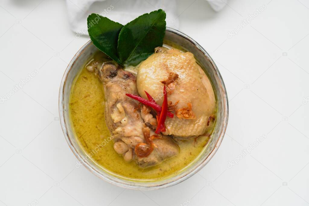 Opor Ayam (Indonesian Curry), Chicken cooked in coconut milk and spices and served to celebrate Idul Fitri / Lebaran  with steam rice 