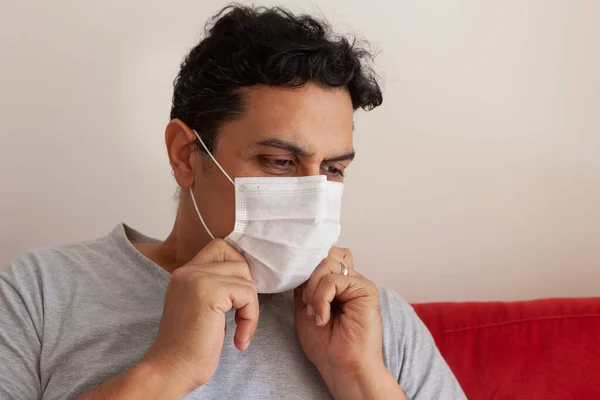 patient wearing disposable surgical mask
