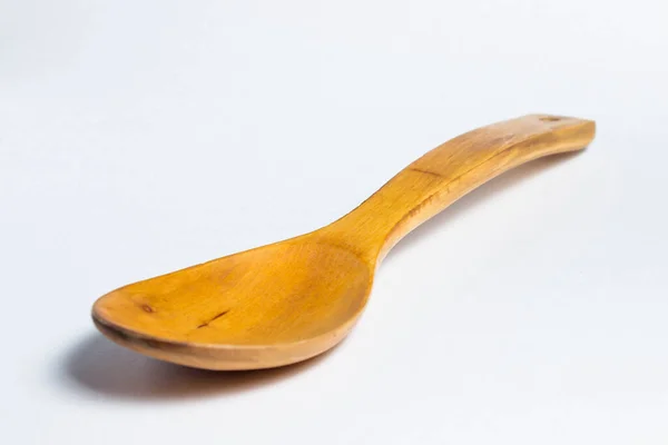 Wooden Spoon Lies White Background — Stock Photo, Image