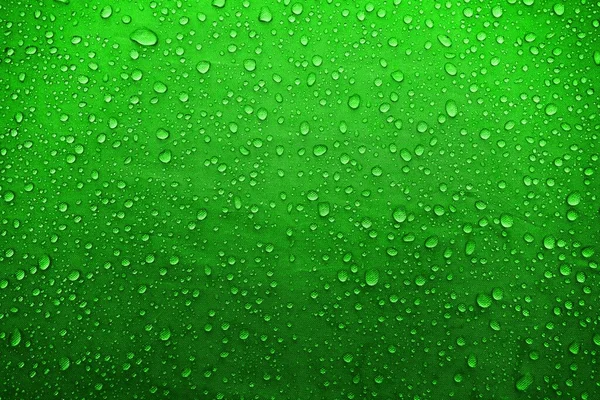 Water drops on fabric. Water drops on green background. Condensate. Water drops background.