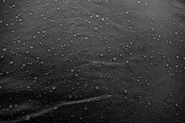 Water drops on fabric. Water drops on grey background. Condensate. Water drops background.