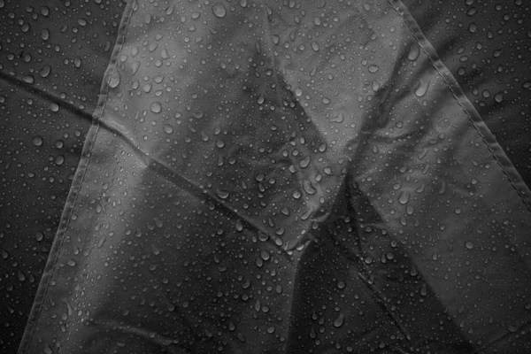 Water drops on fabric. Water drops on grey background. Condensate. Water drops background.