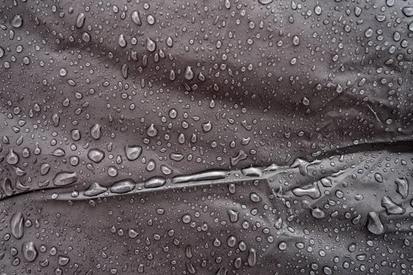 Water drops on fabric. Water drops on grey background. Condensate. Water drops background.