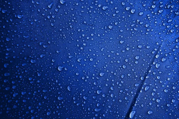Water drops on the fabric. Water drops on the background. Condensate. Water drops background.