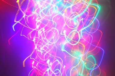 Hareket halindeki kaotik ışıklar odak noktasını bulanıklaştırır - soyut arkaplan. 